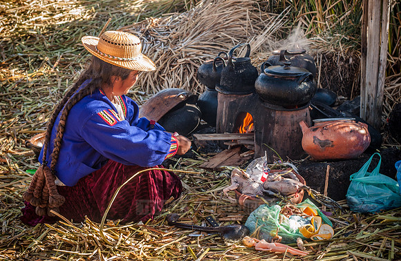 Indigena of local Uros tribe on floating reed islands