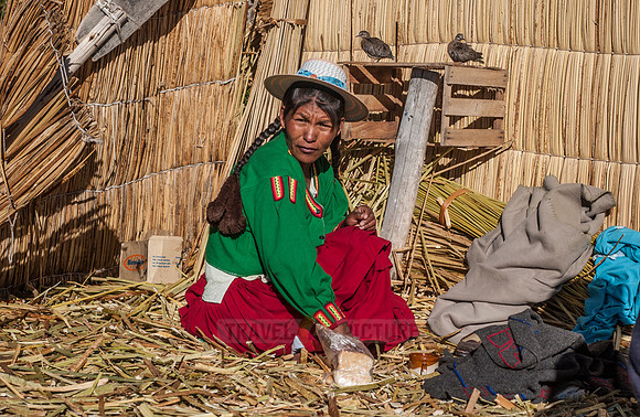 Indigena of local Uros tribe on floating reed islands