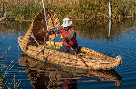 fisherman of local Uros tribe on reed boat