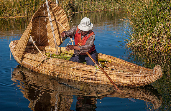 fisherman of local Uros tribe on reed boat