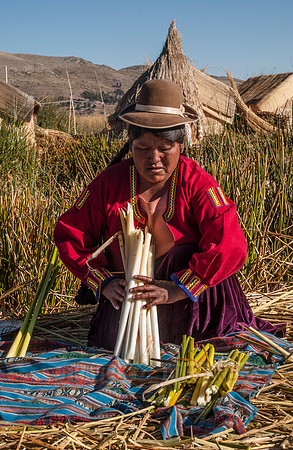 Indigena of local Uros tribe on floating reed islands