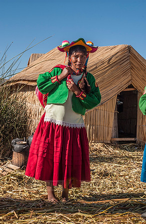 Indigena of local Uros tribe on floating reed islands