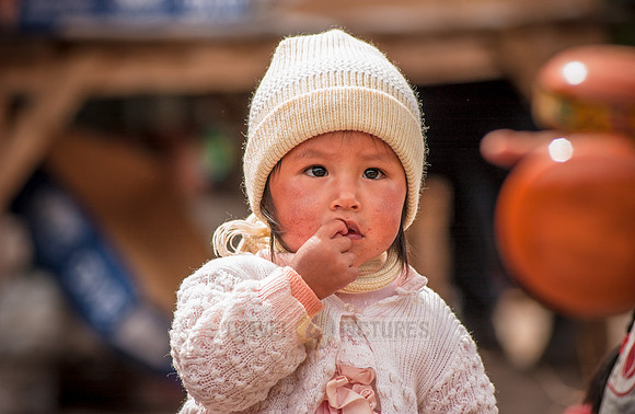 local indigenous child in typical cloth