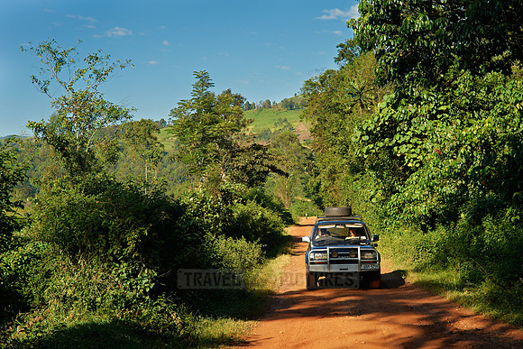 gravel road with car in landscape