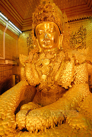 uddha with thick layer of golden leaves in Mahamuni Pagoda