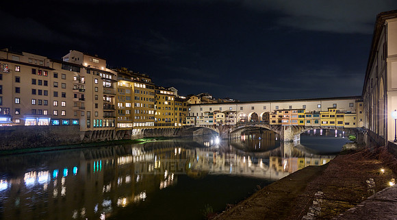 night shot of illuminated medieval brigde Ponte Vecchio