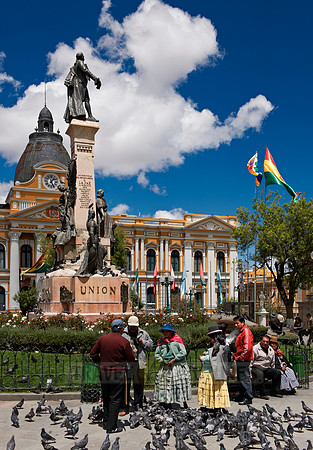 pigeons, statue of president and parliament building