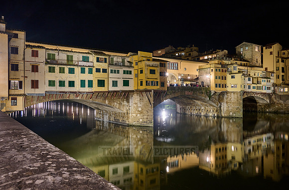night shot of illuminated medieval brigde Ponte Vecchio