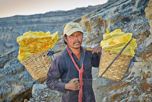 porter carrying heavy baskets