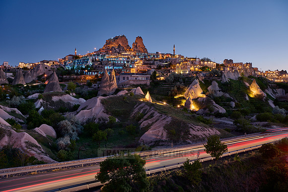 Twilight photo of the perforated castle rock of Uçhisar