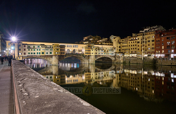 night shot of illuminated medieval brigde Ponte Vecchio