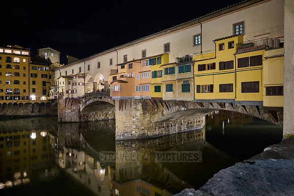 night shot of illuminated medieval brigde Ponte Vecchio