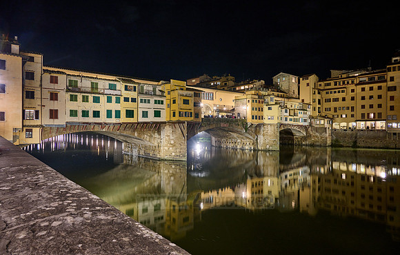night shot of illuminated medieval brigde Ponte Vecchio
