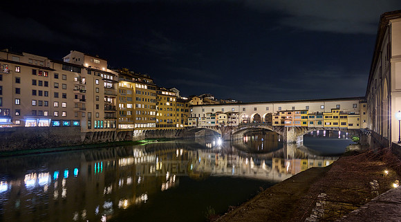 night shot of illuminated medieval brigde Ponte Vecchio
