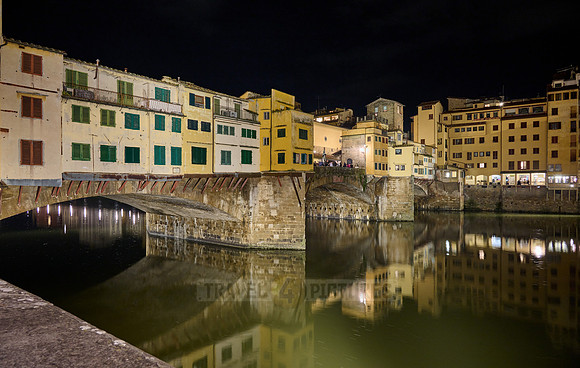 night shot of illuminated medieval brigde Ponte Vecchio