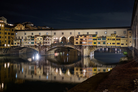 night shot of illuminated medieval brigde Ponte Vecchio