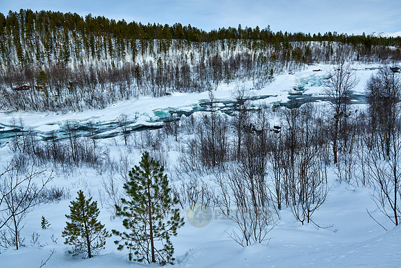 waterfall Malselvfossen covered with snow