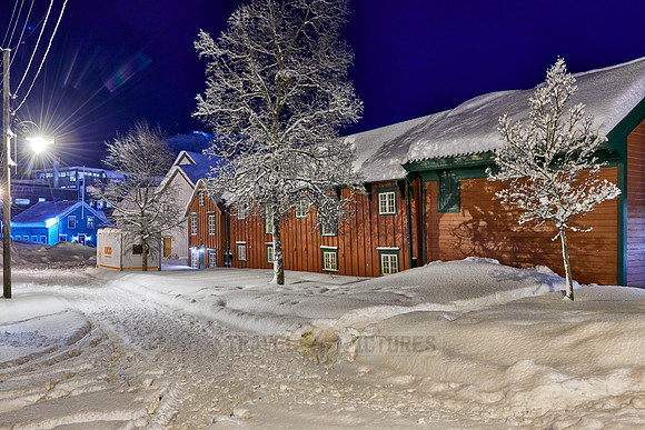 typical wooden buildings in harbor of Tromsø