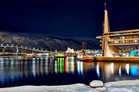 snow covered landscape of harbor in Tromso