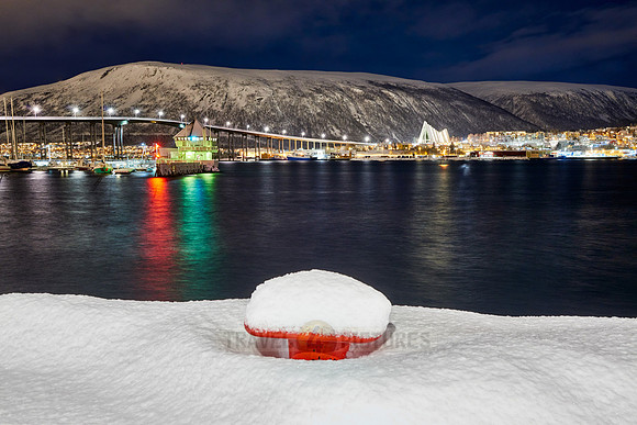 snow covered landscape of harbor in Tromso