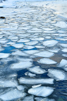 river with ice floes in winter landscape on Senja