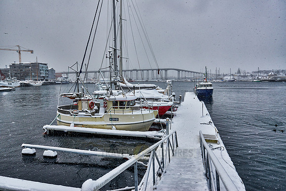 harbor and bridge in Tromsø during strong snow storm