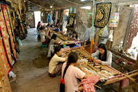 women stitching tapestries