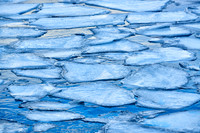 river with ice floes in winter landscape on Senja