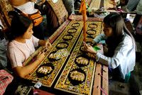 women stitching tapestries