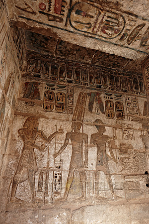 room with colorful bas-reliefs beside column hall