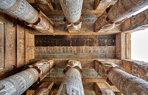magnificent ceiling with colored stone carving in columns hall