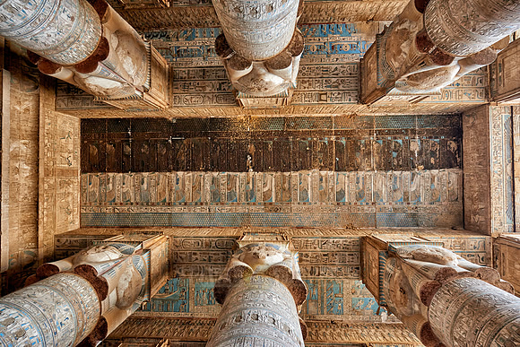magnificent ceiling with colored stone carving in columns hall