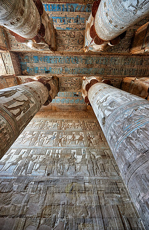 magnificent ceiling with colored stone carving in columns hall