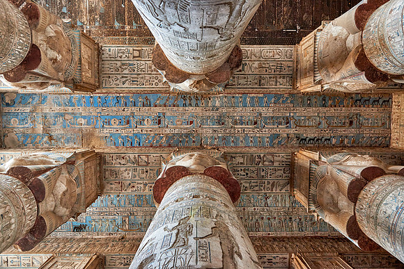 magnificent ceiling with colored stone carving in columns hall