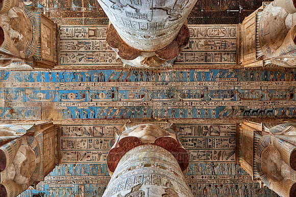 magnificent ceiling with colored stone carving in columns hall