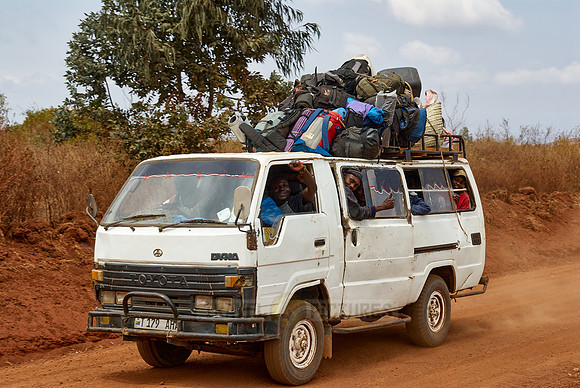porters with baggage in a bus