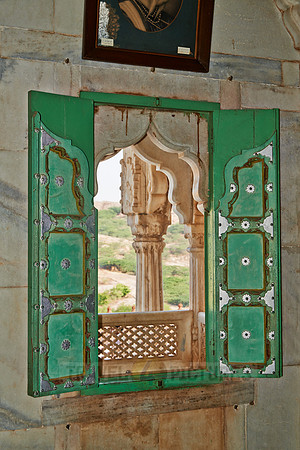 ornamental green window shutter