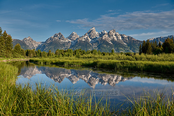 Grand Teton Range with reflection in river at Schwabacher Landing
