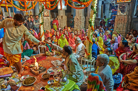 colorful hindu women during ceremony