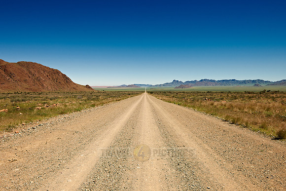 lonesome straight deserted gravel road