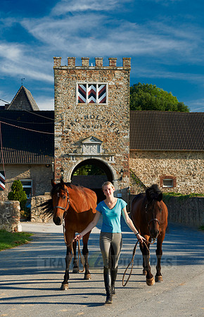 young lady with horses in front of Holzheim castle