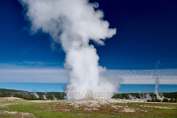 erupting Old Faithful Geyser, Yellowstone National Park, Wyoming