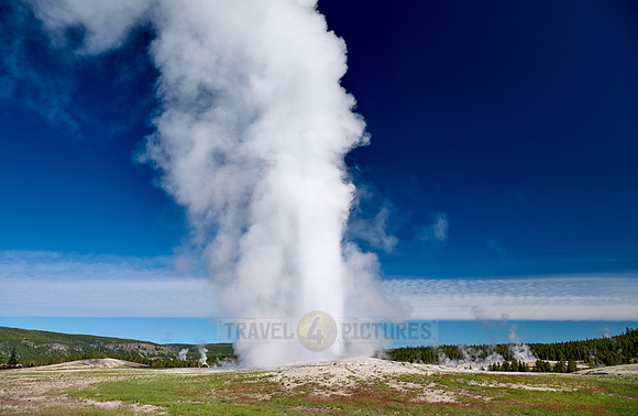 erupting Old Faithful Geyser, Yellowstone National Park, Wyoming