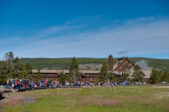 tourists waiting for Old Faithful eruption