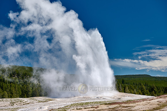 erupting Old Faithful Geyser, Yellowstone National Park, Wyoming