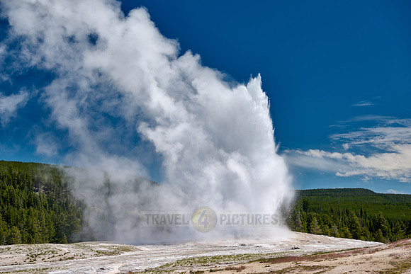 erupting Old Faithful Geyser, Yellowstone National Park, Wyoming