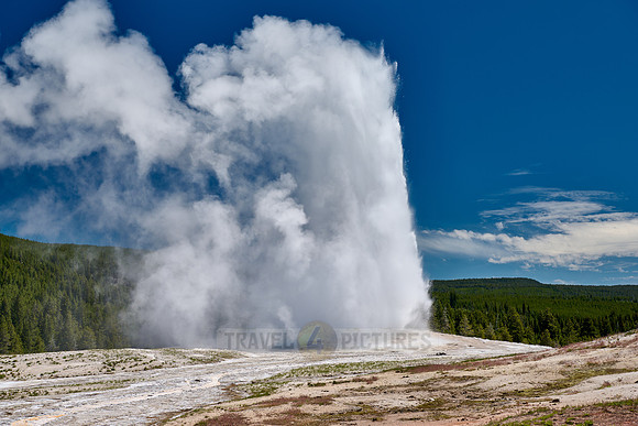erupting Old Faithful Geyser, Yellowstone National Park, Wyoming