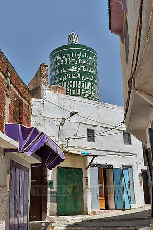 round minaret with inscriptions