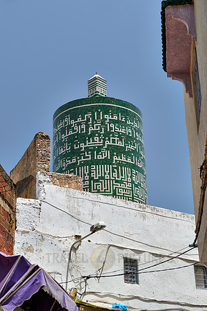 round minaret with inscriptions
