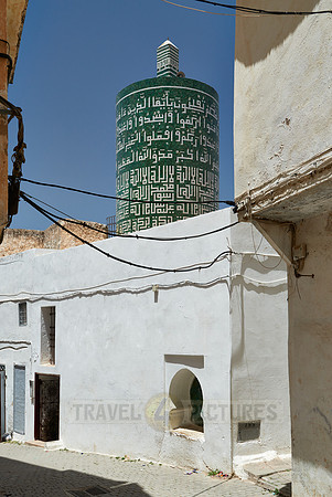 round minaret with inscriptions